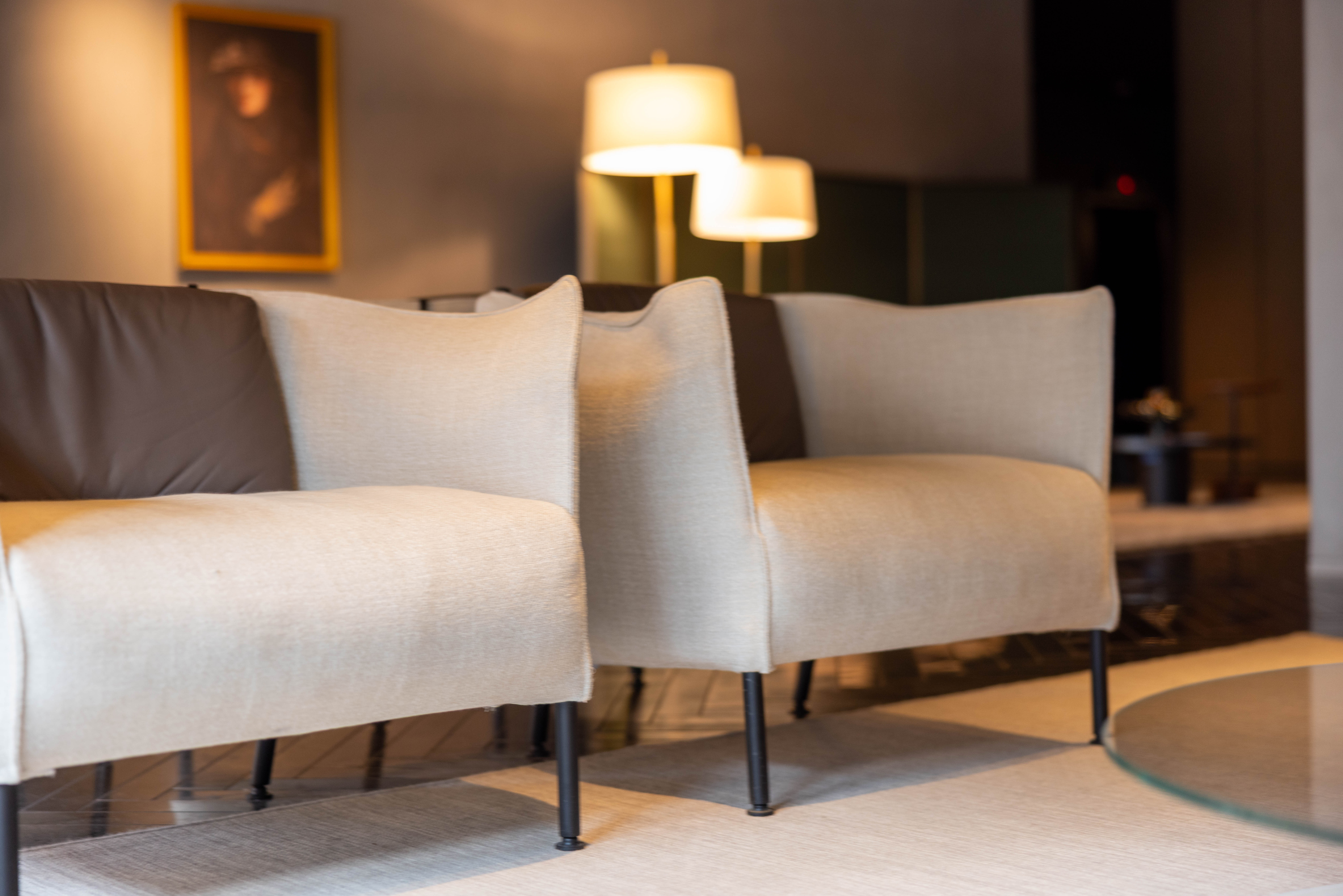 A picture of two cream colored chairs